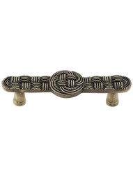 Classic Weave Cabinet Pull in Antique Brass.